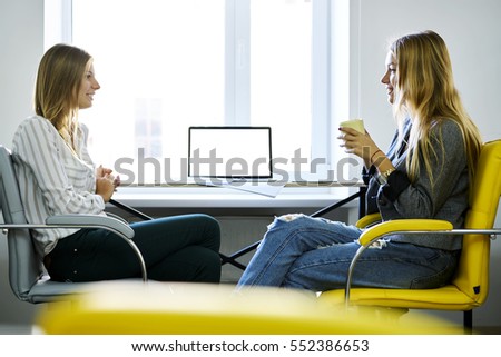 having coffee friendly conversation sitting colleagues shutterstock break young laptop freelancers during female mock connected internet computer cup near screen