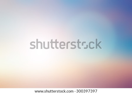 blurred beautiful natural background lens ray flare flash light.blurry sunshine concept.backdrop pastel tone.shore sundown hours.dream magic coastline:royal glamour beach horizon:blush cream teal blue