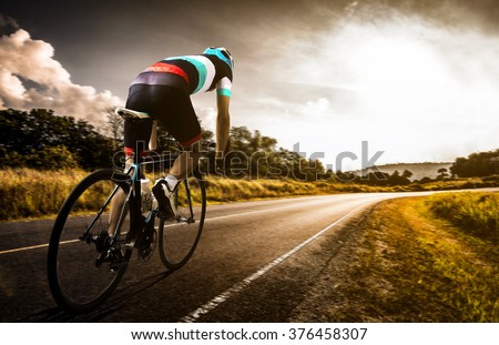 Men cycling road bike in the morning