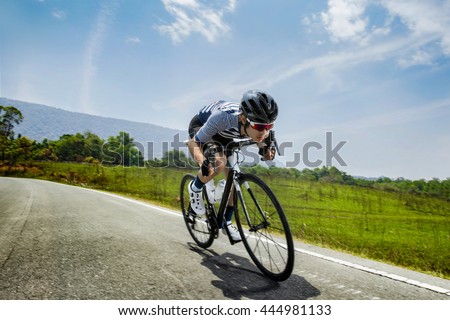 Asian men are cycling road bike in the morning
