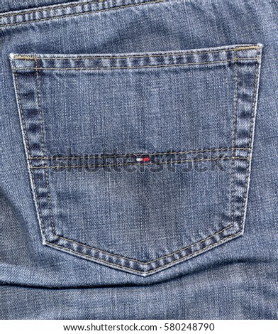NEW YORK, USA - CIRCA JANUARY 2017: Tommy Hilfiger blue jeans detail of a back pocket with logo