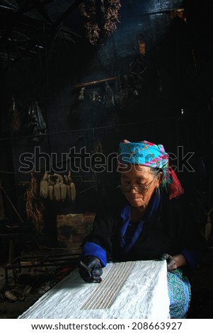 Dien Bien Phu, Dien Bien, Vietnam August 1, 2014: The H'mong ethnic women in the high mountains of decorative painting on canvas, this is one of their traditional occupation.