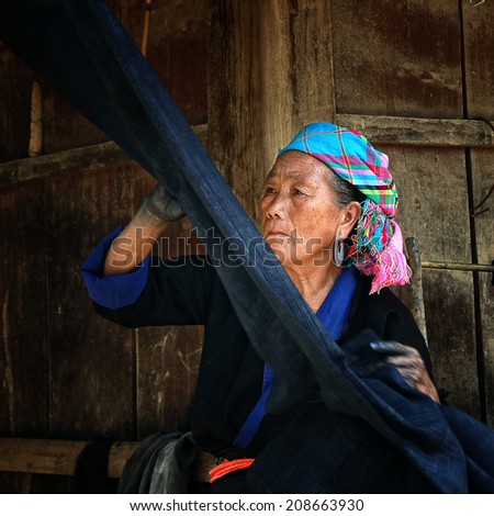 Dien Bien Phu, Dien Bien, Vietnam August 1, 2014: The H'mong ethnic women in the high mountains of decorative painting on canvas, this is one of their traditional occupation.