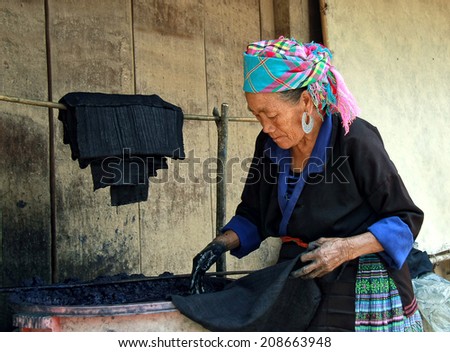 Dien Bien Phu, Dien Bien, Vietnam August 1, 2014: The H'mong ethnic women in the high mountains of decorative painting on canvas, this is one of their traditional occupation.