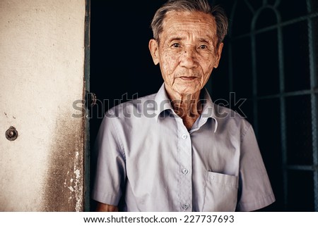 VINH LONG, VIETNAM -DECEMBER 29: Lively 89-year-old Vietnamese man in the Mekong delta near Vinh Long on December 29,2013. The Mekong delta is a major tourist destination to experience rural Vietnam.