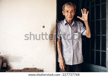 VINH LONG, VIETNAM -DECEMBER 29: Lively 89-year-old Vietnamese man in the Mekong delta near Vinh Long on December 29,2013. The Mekong delta is a major tourist destination to experience rural Vietnam.