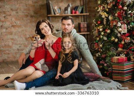 Christmas family portrait in home holiday living room kids and baby with present gift box Christmas family portrait in home holiday living room kids and baby with present gift box