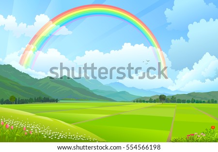 Rainbow over the mountains, hills and rice fields