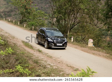 Bac Giang, Viet Nam - March 17, 2015: A SUV Peugeot 3008 car running on the road in Vietnam