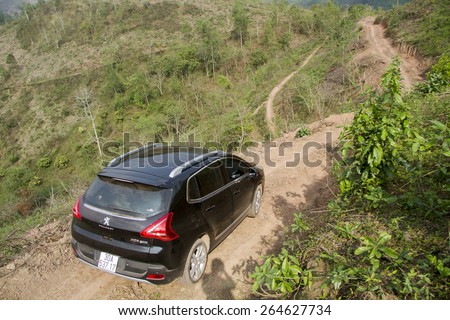 Bac Giang, Viet Nam - March 17, 2015: A SUV Peugeot 3008 car running on the mountain road in Vietnam