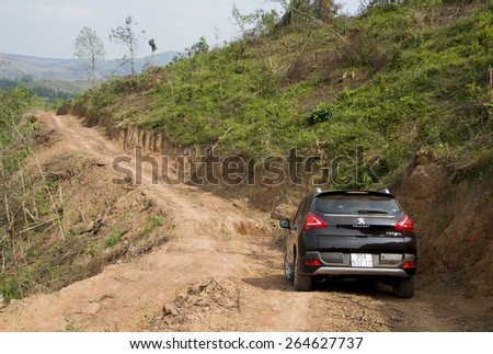 Bac Giang, Viet Nam - March 17, 2015: A SUV Peugeot 3008 car running on the mountain road in Vietnam