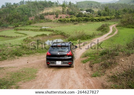 Bac Giang, Viet Nam - March 17, 2015: A SUV Peugeot 3008 car running on the mountain road in Vietnam