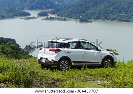 Hoa Binh, Viet Nam - Aug 7, 2015: Hyundai i20 Active car running on the moutain road in Vietnam
