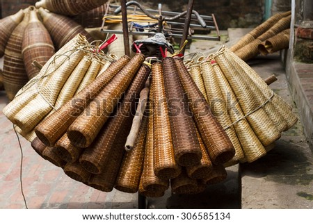 Weaving bamboo fish trap in HungYen, Vietnam. Weaving this tools that used to catch fish is traditional occupation in Hung Yen province.