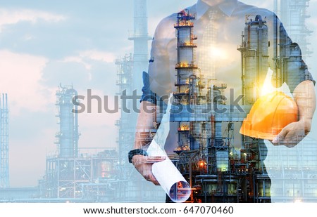 Double exposure of Engineer with safety helmet with oil refinery industry plant background