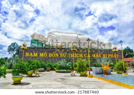 TIEN GIANG, VIETNAM - JULY 12, 2014: Sleeping Buddha statue located in the famous Vinh Trang pagoda in My Tho city, Tien Giang province, Vietnam.
