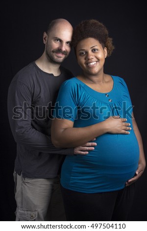https://thumb1.shutterstock.com/display_pic_with_logo/2407808/497504110/stock-photo-happy-inter-racial-couple-pregnant-african-american-wife-and-caucasian-husband-caressing-baby-belly-497504110.jpg