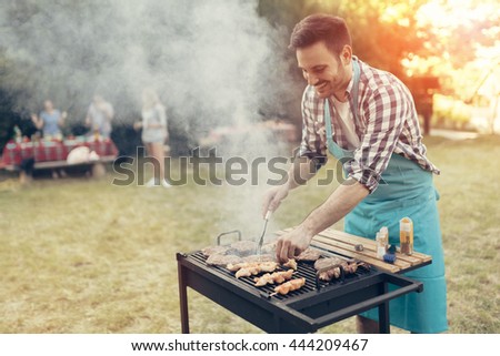 Barbecue in nature being done by friends