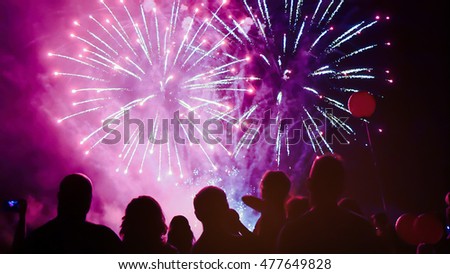 Crowd watching fireworks and celebrating