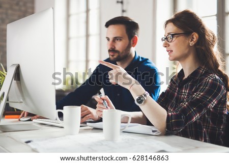 Software engineers working on project and programming in company
