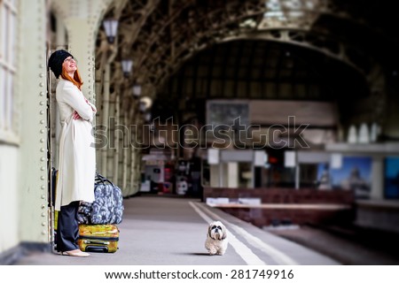 https://thumb1.shutterstock.com/display_pic_with_logo/2423804/281749916/stock-photo-elegant-lady-with-shih-tzu-dog-and-suitcases-on-the-platform-waiting-a-train-at-the-vitebsk-railway-281749916.jpg