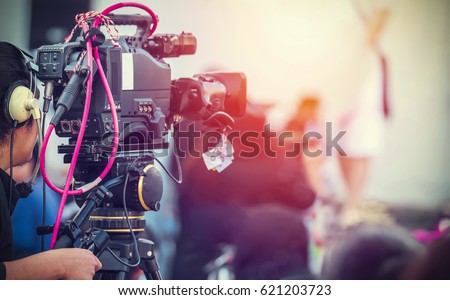 Video camera operator working with his equipment
