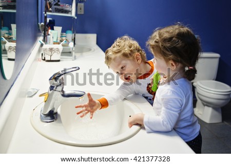 Image result for a little boy and a girl brushing their teeth