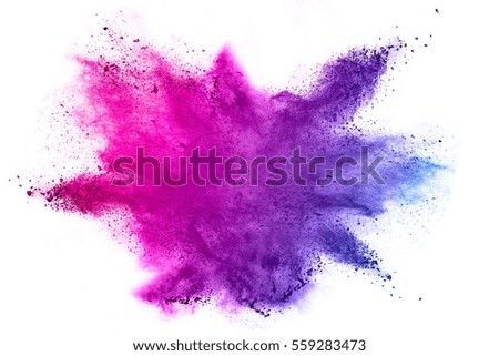 Explosion of colored powder on white background