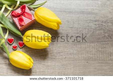 Yellow tulips on wooden boards. Valentine's Day. Women's Day