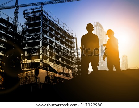 silhouette Businessman engineer looking blueprint in a building site over Blurred construction site film grain progress and potential personal and career growth concepts.