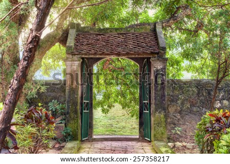 oriental gate in the tropical asian garden, Ninh Binh province, Vietnam