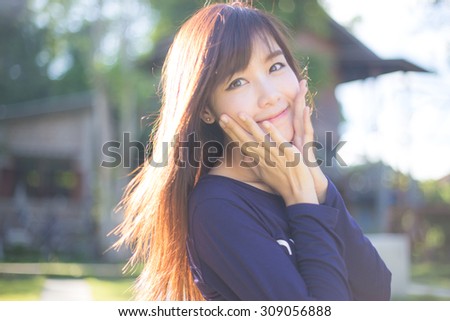 Outdoor portrait of a beautiful asian girl vintage tone.
