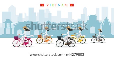Vietnamese Women with Conical Hat Ride Bicycles, Landmarks Background, Culture, Travel and Tourist Attraction