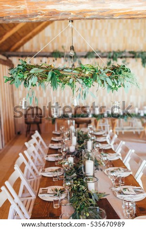 Rustic Wedding Decor Wreath Chandelier Decorated With Eucalyptus And Table Rustic Wedding Decor Wreath Chandelier Decorated With Eucalyptus And Table