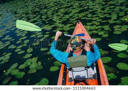 Man swinging oar photo