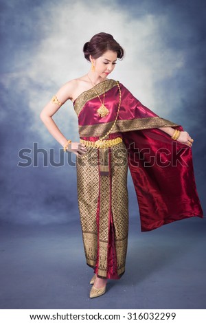 https://thumb1.shutterstock.com/display_pic_with_logo/2496775/316032299/stock-photo-portrait-beautiful-thai-woman-in-vintage-thai-traditional-costume-red-color-dress-smiling-in-studio-316032299.jpg