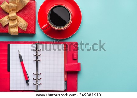 Boxes with gifts on a blue cyan background. White notepad. Happy new year. Space for text. Colorful Concept. New Year background. Christmas. Xmas. Noel.