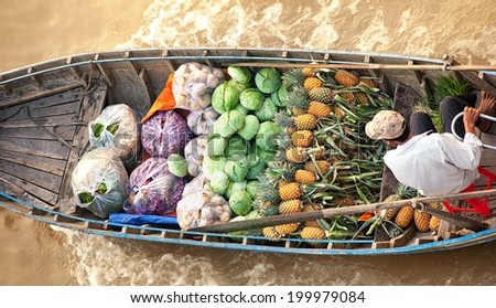 Vietnam, Mekong river delta. Boat on traditional floating market