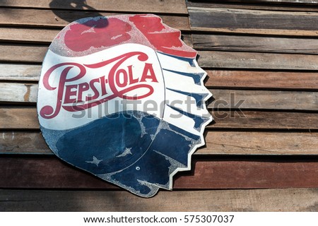 Bangkok, Thailand - January 30,2017 : The old rust condition vintage of Pepsi Cola sign on the wooden wall