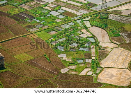 Jan 10, 2016: Valley of Mai Chau, Hoa Binh, Vietnam: As a countryside with the famous fragrant sticky rice. Multiple plots are being filled with water, plowed in preparation for new farming season.
