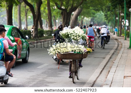 Hanoi, Vietnam - Nov 22, 2016: Life in Vietnam. An unidentified Street vendors. The Flower seller in streer of Hanoi.