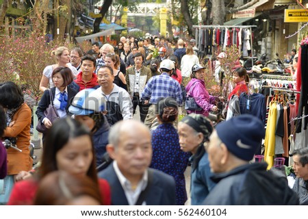 Hanoi, Vietnam - Jan 23,2017: Hanoi's people go to shop for Tet's flower market items served for Tet. The market is open until the last day of the old year according to the lunar calendar.
