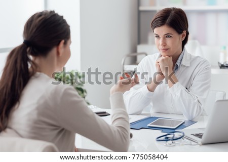 Doctor working in the office and listening to the patient, she is explaining her symptoms, healtcare and assistance concept