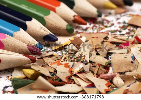 Creative mess on the table cartoonist. Colorful wooden pencils.