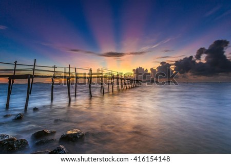 SAI GON, VIET NAM - JAN 10, 2016: sunrise on the sea with shadow rudimentary leaves home on the Can Gio sea.