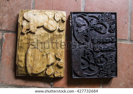 BAC NINH, VIETNAM - JULY 25, 2015 - Wooden painting is being made in workshop by craftsman in Dong Ho folk painting village