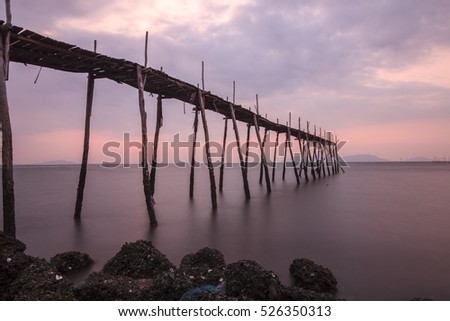 SAI GON, VIET NAM - JAN 10, 2016: sunrise on the sea with shadow rudimentary leaves home on the Can Gio sea.