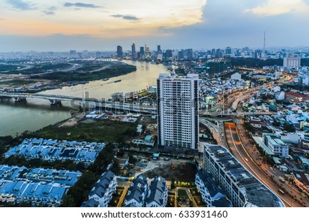 SAIGON, VIETNAM - DEC 23, 2016 : Impression landscape of Ho Chi Minh city at night , Saigon river flows through the city, this photo was taken at Sai Gon pearl building.