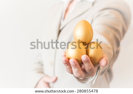 https://thumb1.shutterstock.com/display_pic_with_logo/2635591/280855478/stock-photo-business-woman-man-holding-golden-eggs-forward-a-golden-egg-opportunity-concept-of-fortune-and-280855478.jpg