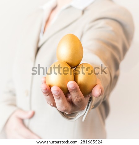 https://thumb1.shutterstock.com/display_pic_with_logo/2635591/281685524/stock-photo-business-woman-man-handling-gold-eggs-forward-a-golden-egg-opportunity-concept-of-fortune-and-a-281685524.jpg